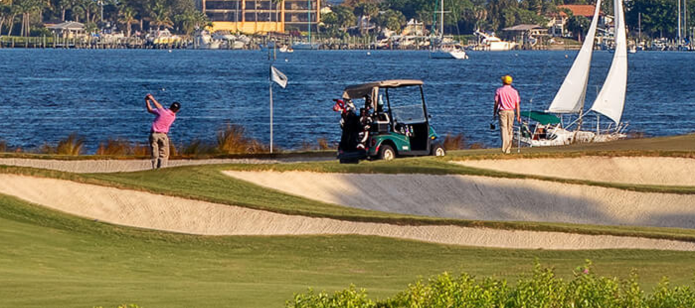 Golfers at Floridian National Golf Club with travel bags, representing BagCaddie golf travel destinations.