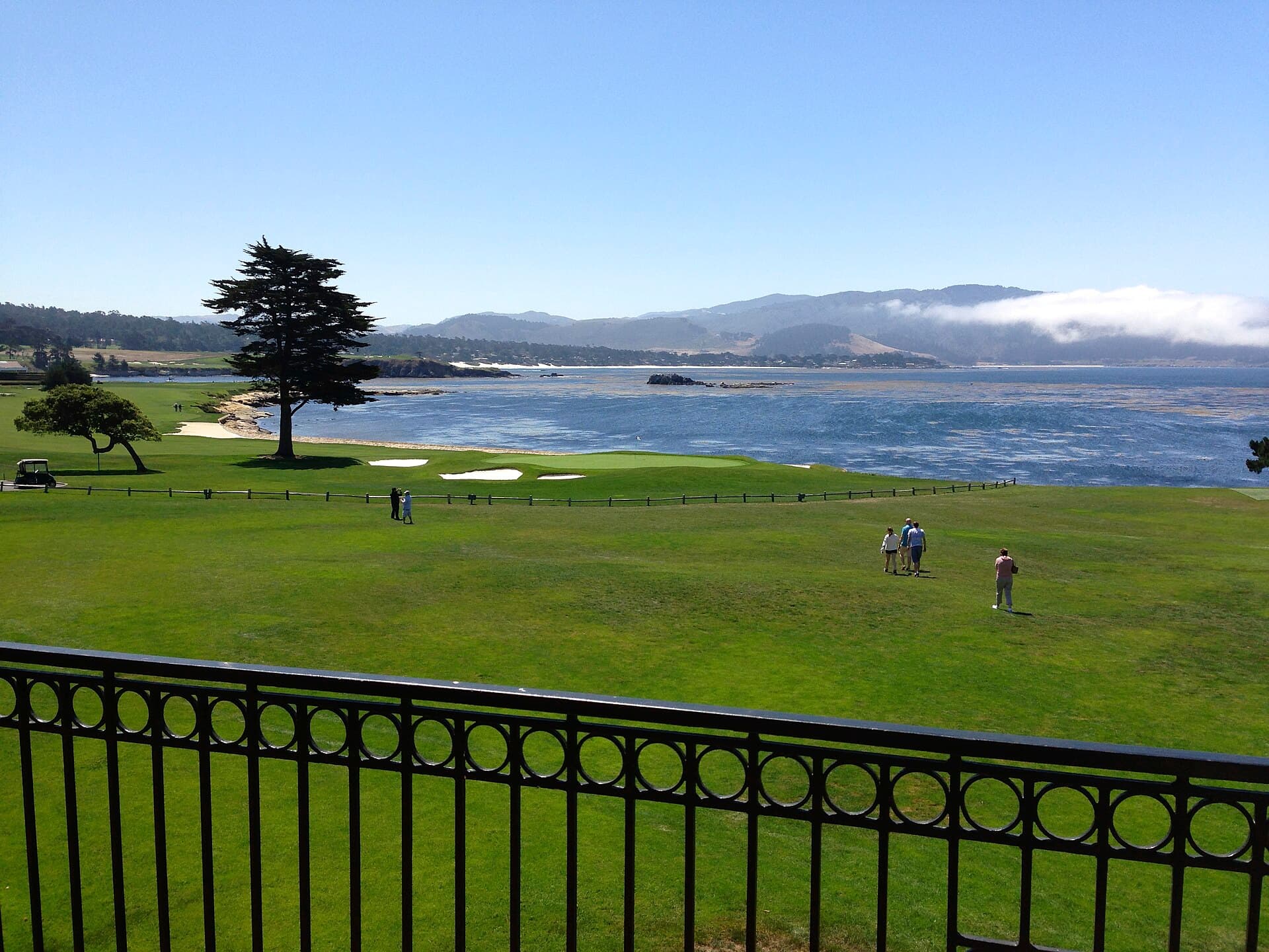18th green at Pebble Beach Golf Links along Carmel Bay