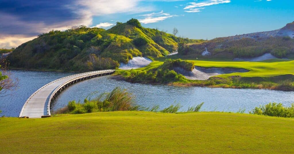 Streamsong Resort boardwalk across water with dunes beyond
