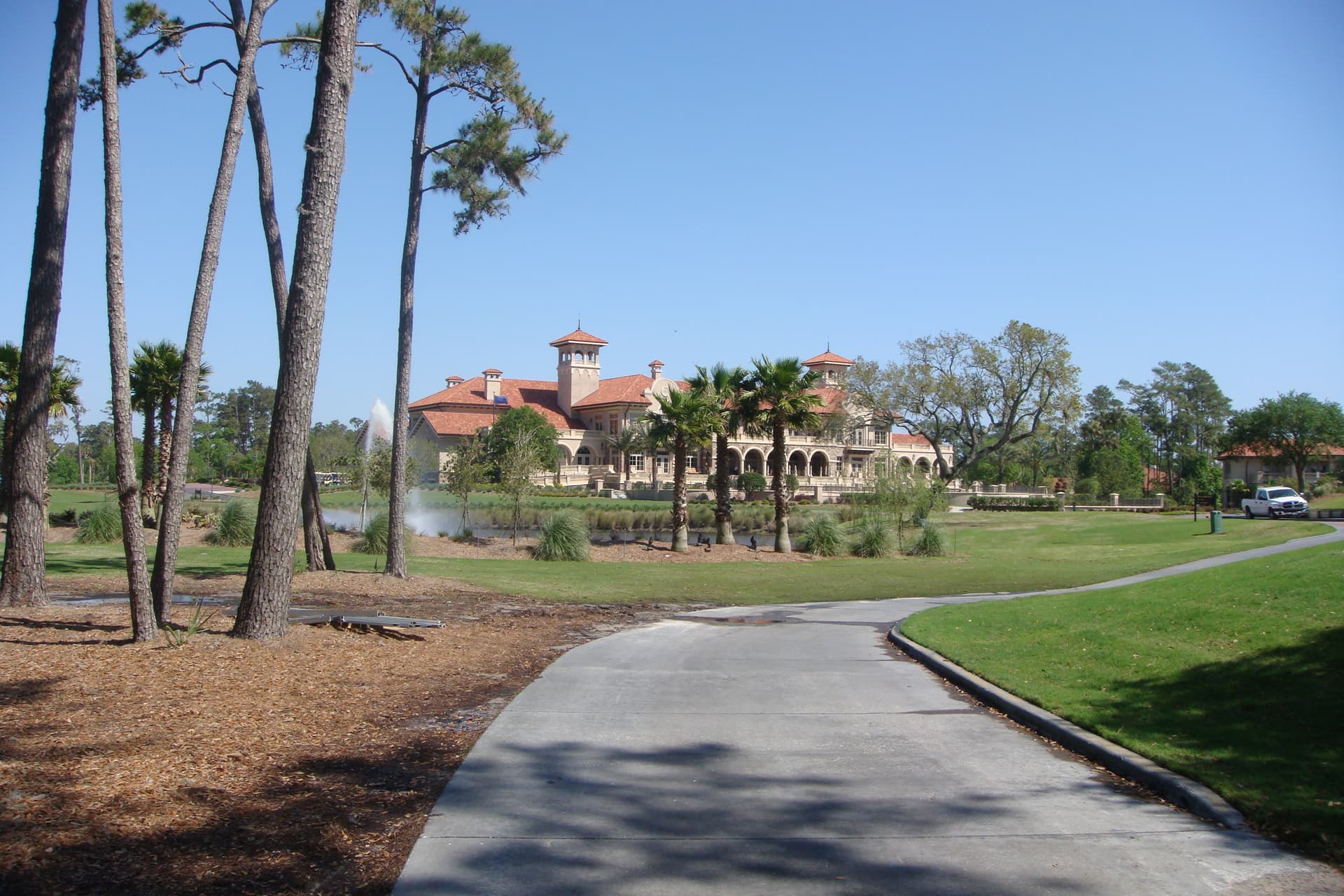 TPC Sawgrass clubhouse with palms and pines in Ponte Vedra Beach