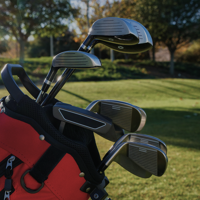 Golf clubs in a golf bag on the course, ready for secure shipping and travel with BagCaddie.
