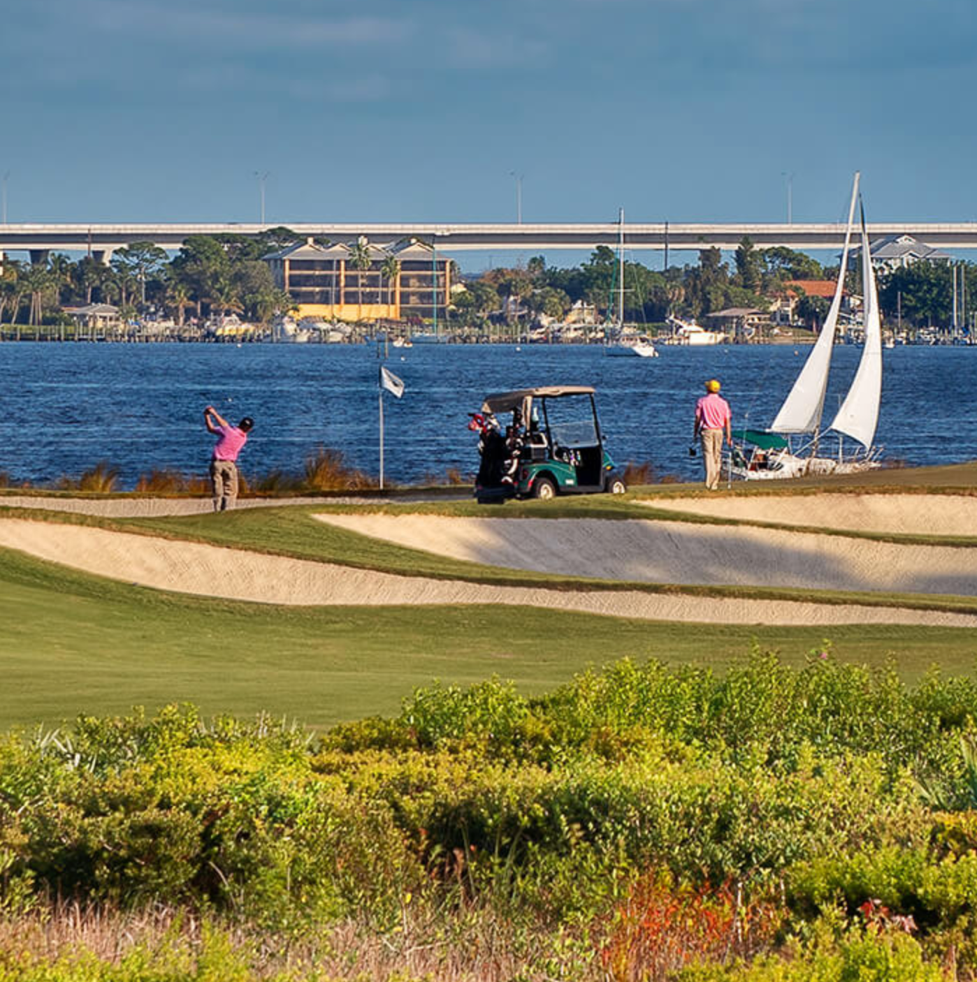 Golfers at Floridian National Golf Club with travel bags, representing BagCaddie golf travel destinations.
