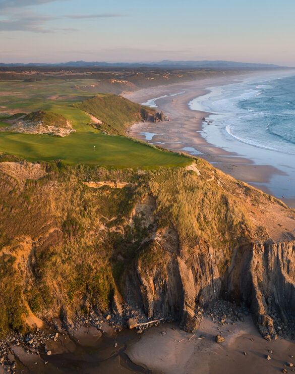 Aerial view of the Sheep Ranch golf course perched on dramatic oceanfront cliffs along the Oregon coastline.